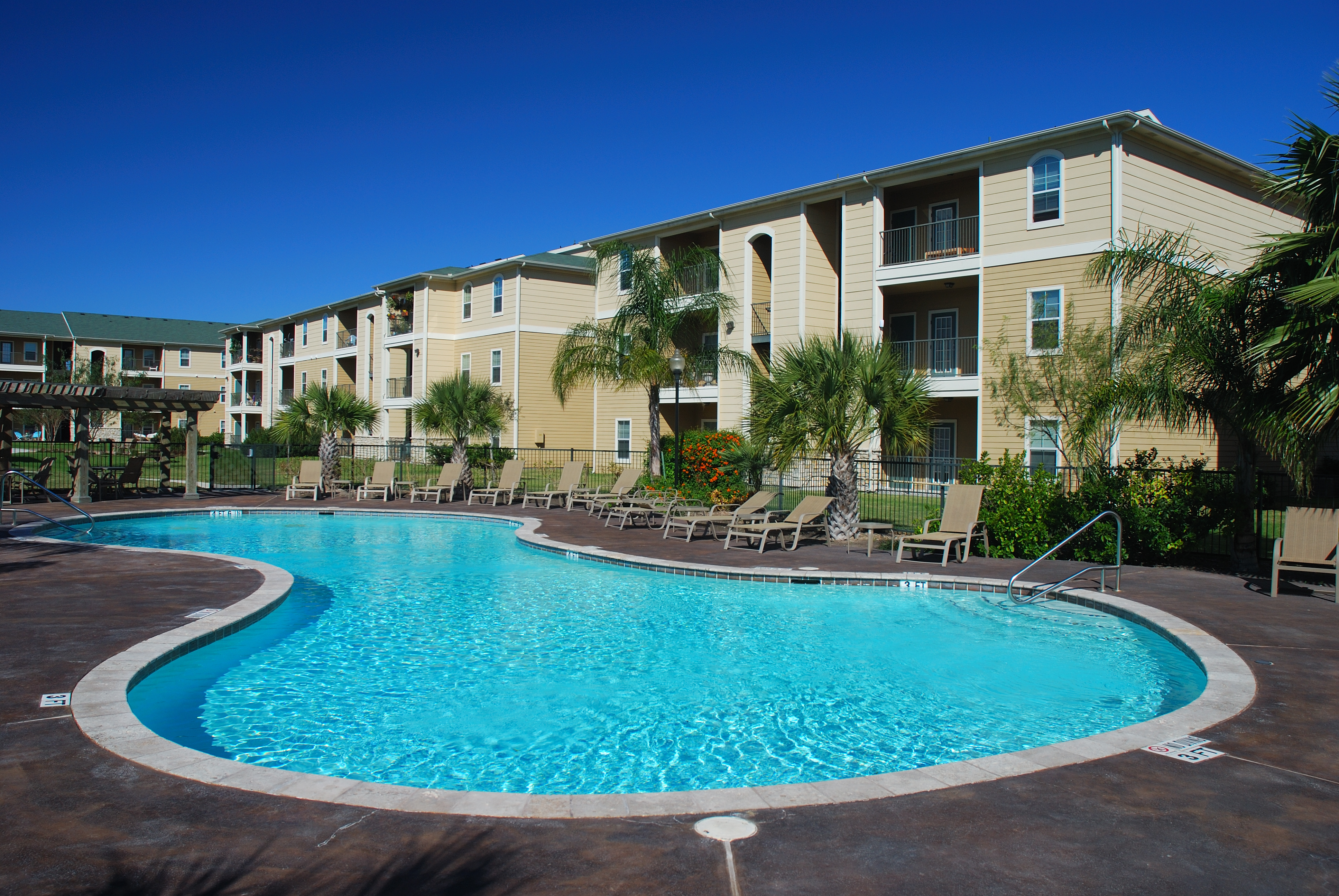 apartment-building-with-large-round-pool-property-management